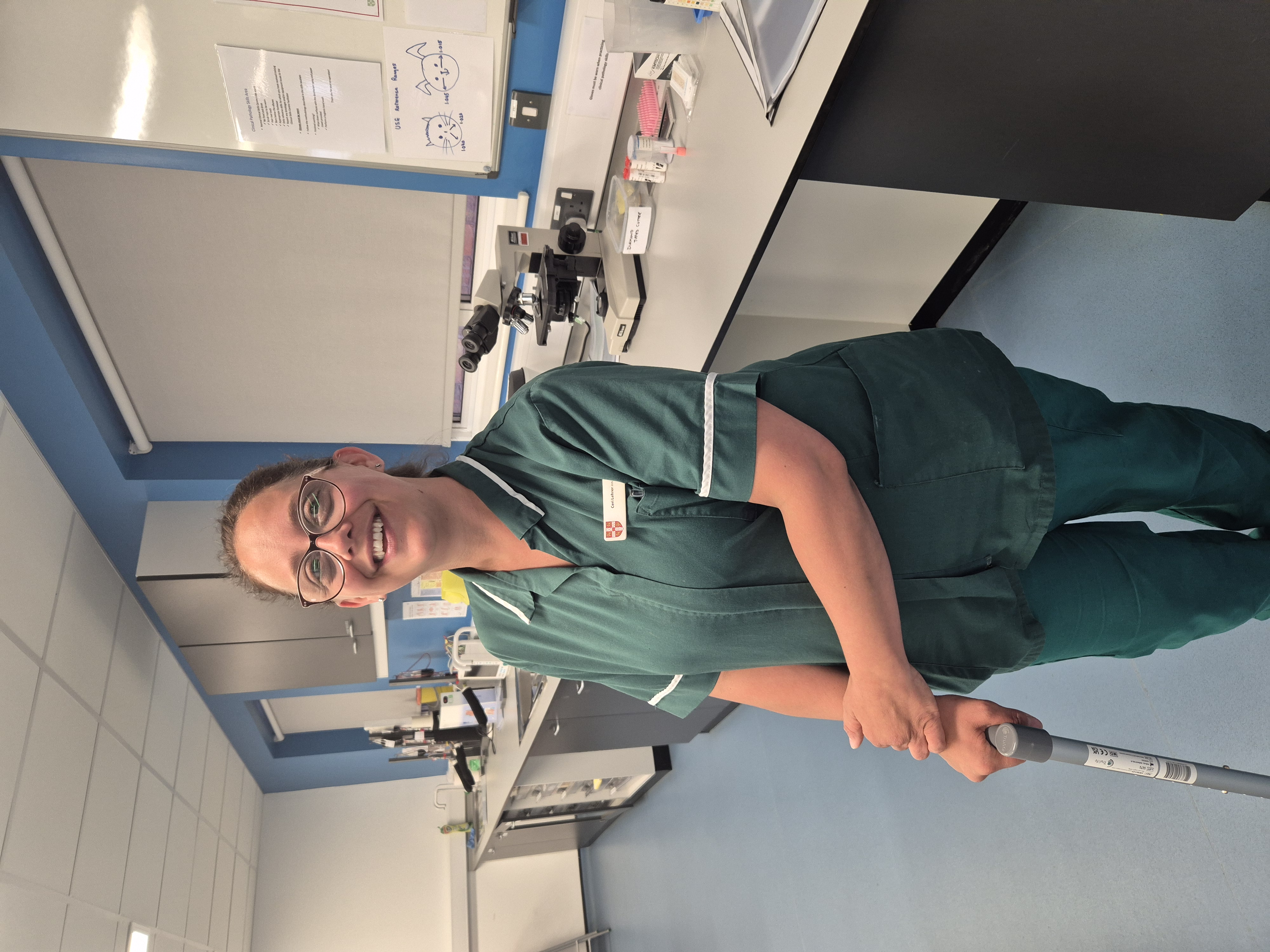 QVSH Nurse standing in clinical area with walking stick